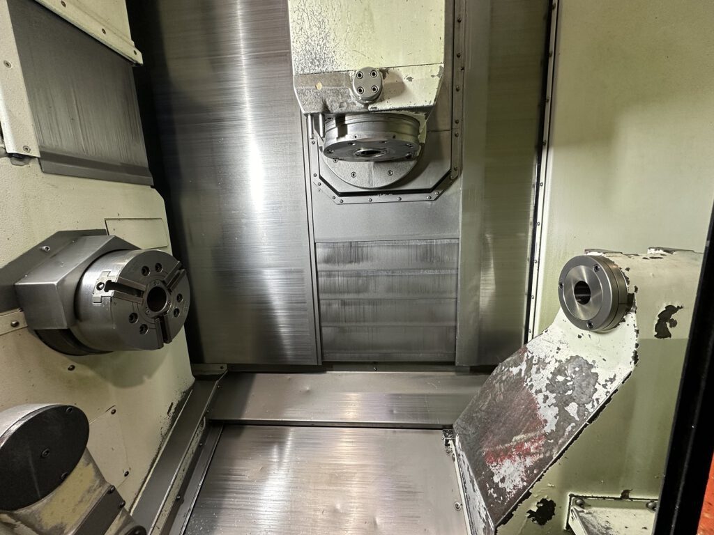 Working area of the used Mazak Integrex J-200 with visible main spindle, milling spindle and tailstock – precise CNC complete machining